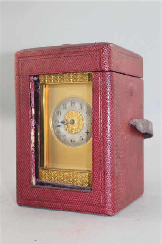 A late 19th century French ormolu hour repeating carriage clock, 7in., with travelling case